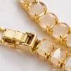 A golden oval-shaped bracelet set with light-colored gemstones, a fashionable and elegant women's jewelry accessory, is presented as a gift Application Scenario